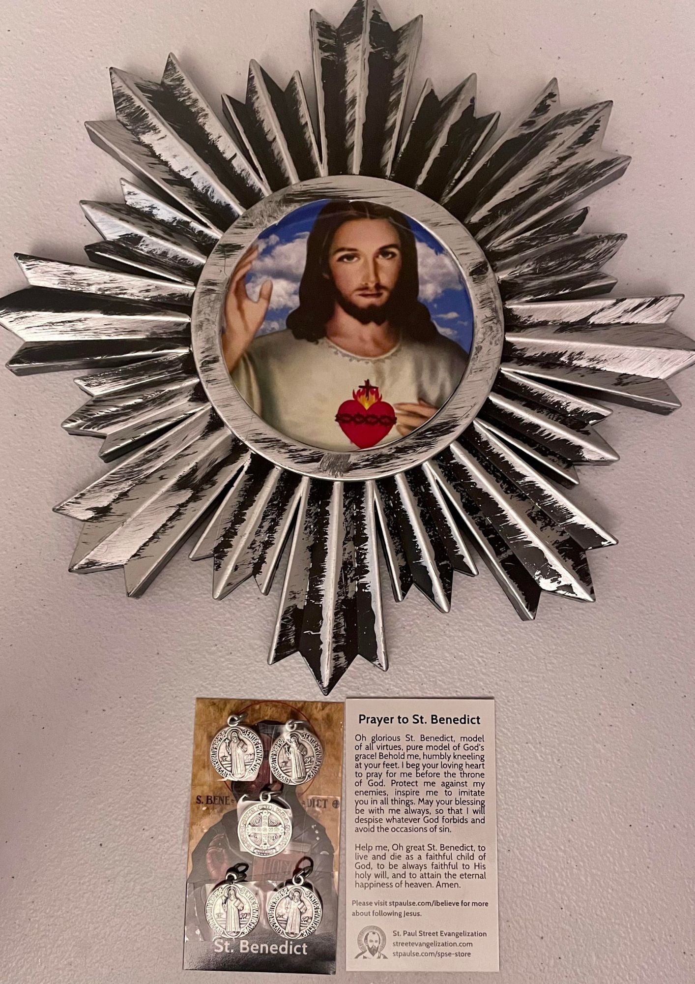 SACRED HEART OF JESUS/SAINT BENEDICT/ORNATE PLASTIC FRAME WALL DECOR ROUND WITH SAINT BENEDICT PRAYER LEAFLET AND MEDALS